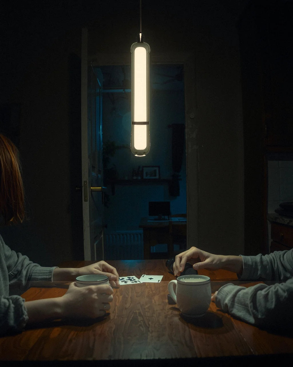 The Adventure Lamp hanging above a kitchen table during a power cut
