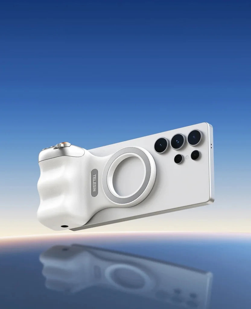 The Grip on a phone against a blue sky