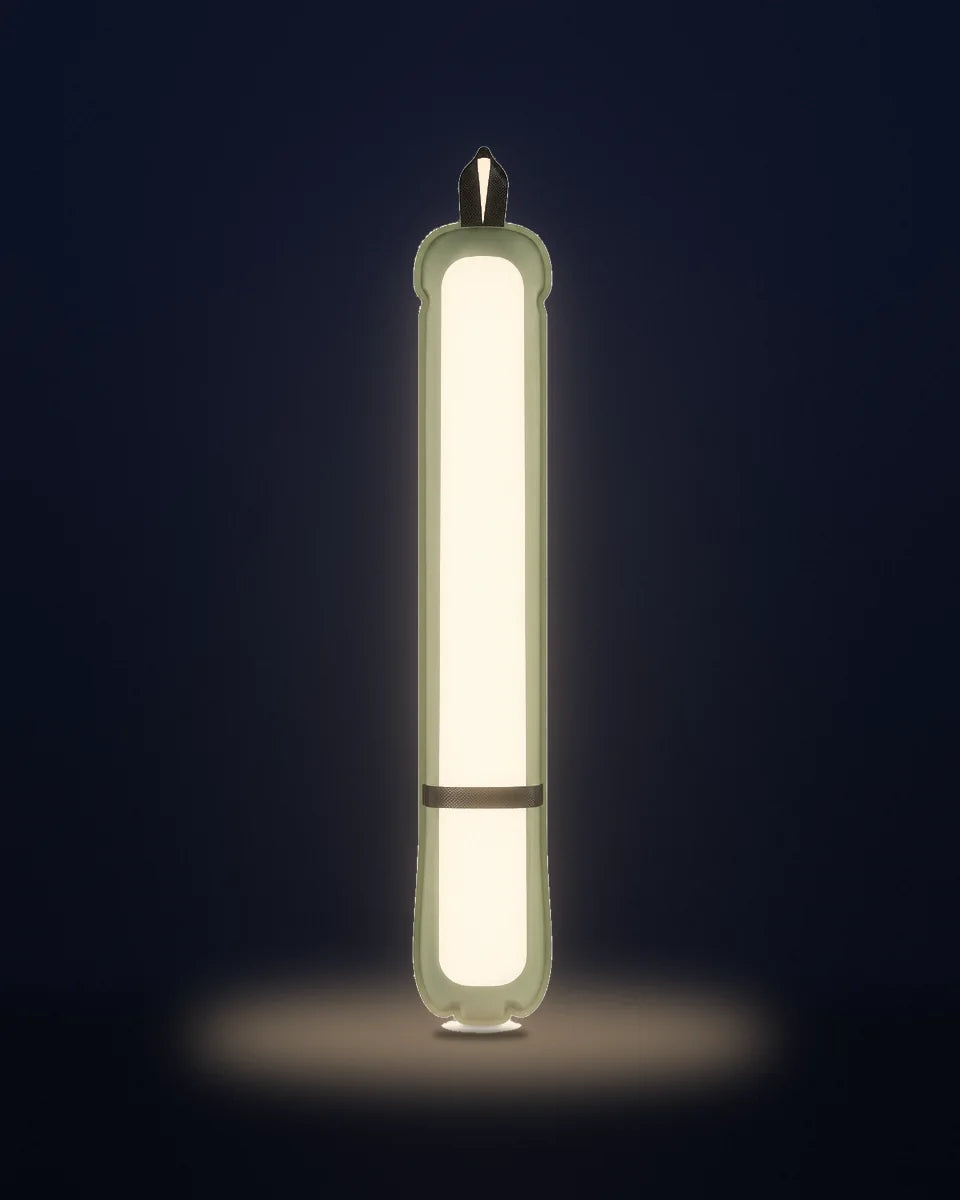 The Adventure Lamp switched on, olive body and warm diffuser